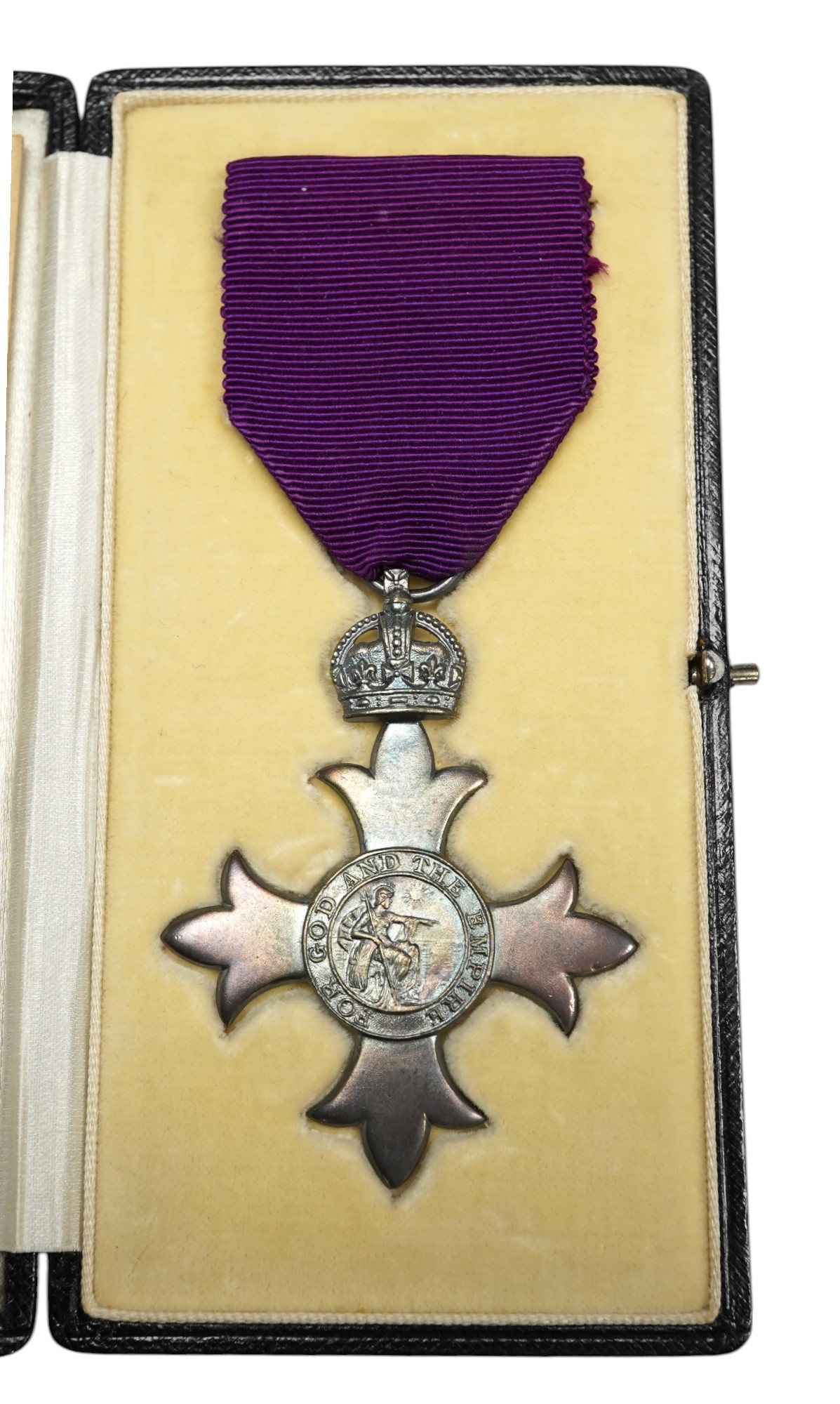 Order of the British Empire civil M.B.E. With first type purple ribbon, George V sterling silver by Garrards, hallmark for 1919, cased with instruction leaflet for wearing the insignia. Condition - good.